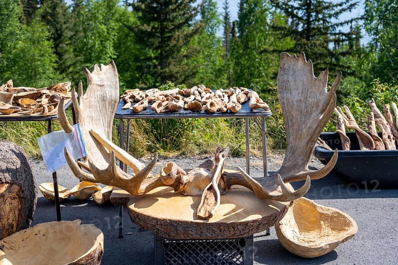 Sales stand for souvenirs with elk antlers and wood carving, Alaska, USA