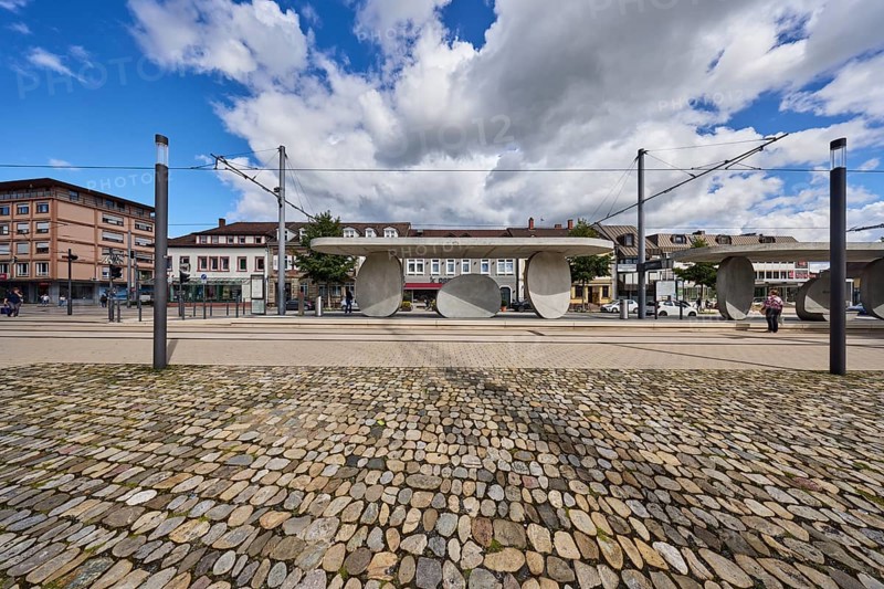 Kehl Rathaus tram stop, trolley masts, overhead lines, lantern, general architecture, houses, buildings, walkway made of natural stones, blue partly cloudy sky, cumulus clouds, cumulus congestus clouds, main street, Kehl, Upper Rhine plain, Ortenau district, Baden-Württemberg, Germany