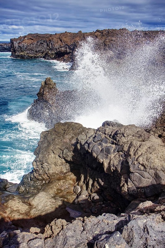 Coastal scene with waves breaking against rocks under a cloudy sky, Playa del Janubio, Yaiza Lanzarote