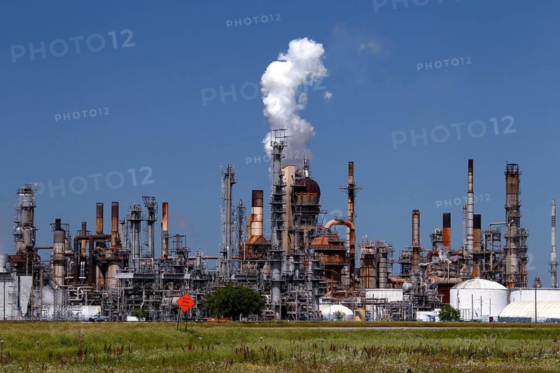 Large refinery plant with smoking chimneys and industrial structures, Mississippi Valley, USA