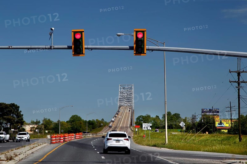 A bridge across a road with traffic lights and passing cars in the Mississippi Valley, Mississippi Valley, USA
