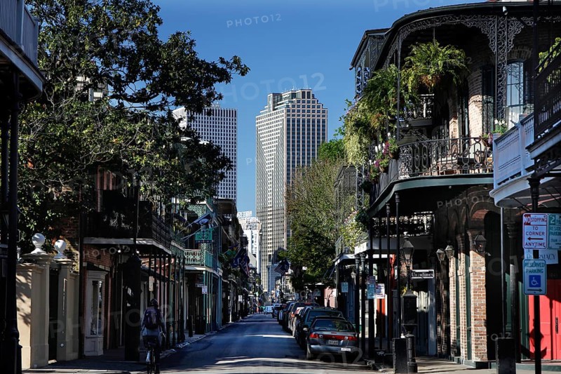 Charming street in the French Quarter with skyscraper in the background, New Orleans, Louisiana, USA