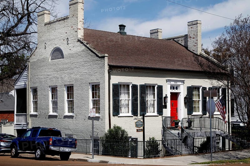 Historic house with red door in urban area, Natchez, USA