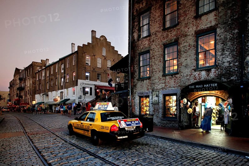Evening scene on Savannah Riverfront with taxi and beautiful lights, Savannah, Georgia, USA