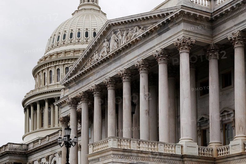 Detailed view of the Capitol with distinctive dome and column-decorated building, Washington D.C, USA