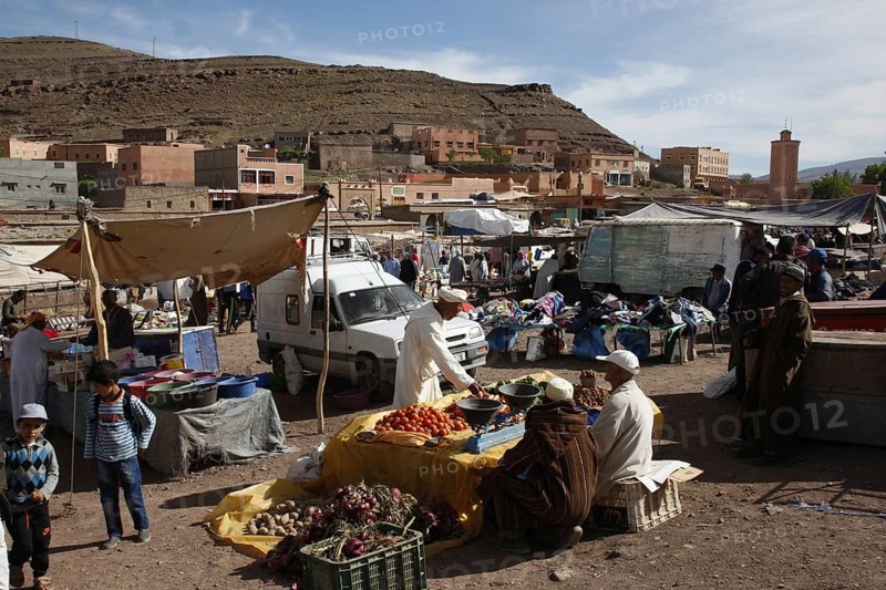 Lively market with numerous stalls and busy people in Msemrir, Msemrir, Region, MA