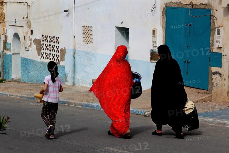 Two woman wearing traditional clothes in the old town of Sidi Ifni, Sidi Ifni, Souss-Massa, Morocco
