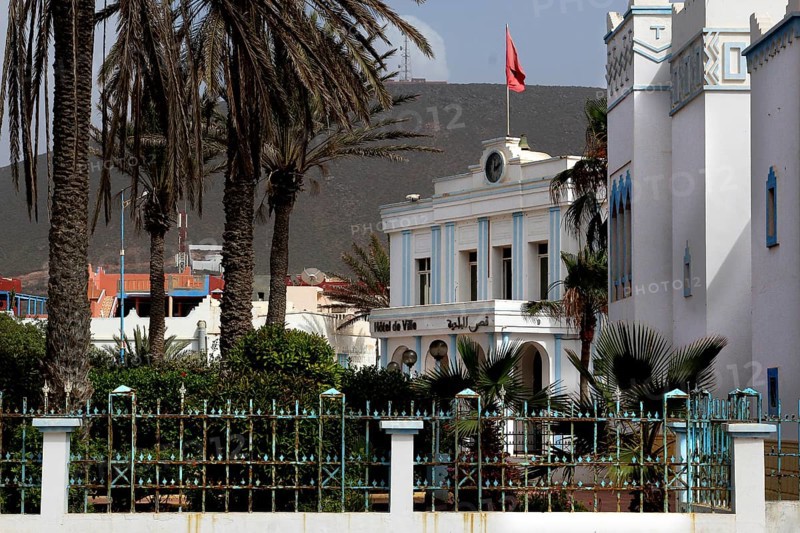 Spanish town hall flanked by palm trees in the old town of Sidi Ifni, Sidi Ifni, Guelmim-Oued Noun region, Morocco