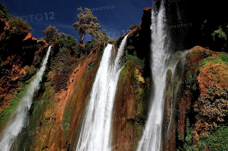 Majestic waterfalls of Ouzoud surrounded by lush vegetation and rocks, Ouzoud, Morocco