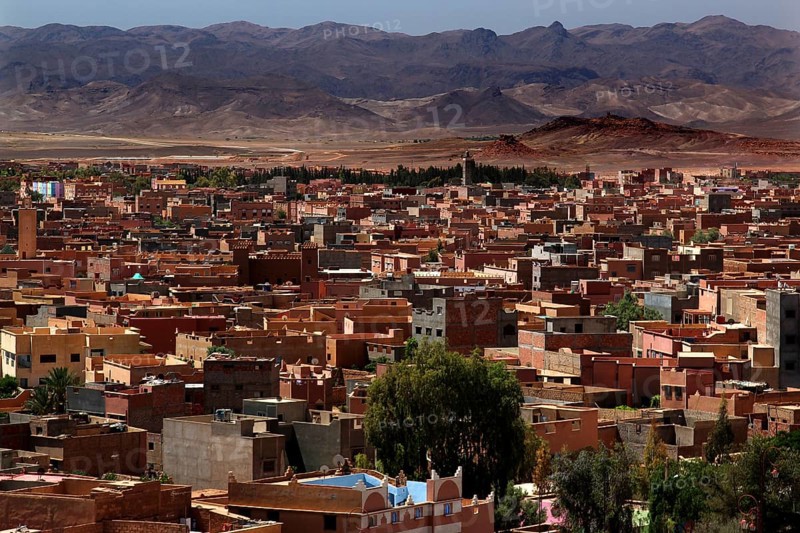 Overview of the city of Tinerhir with roofs and mountains behind them, Tinerhir, Morocco