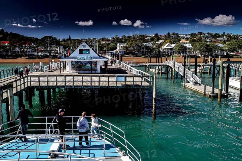 Russell Harbour with jetties and boats on blue water, Russel, Northland, New Zealand