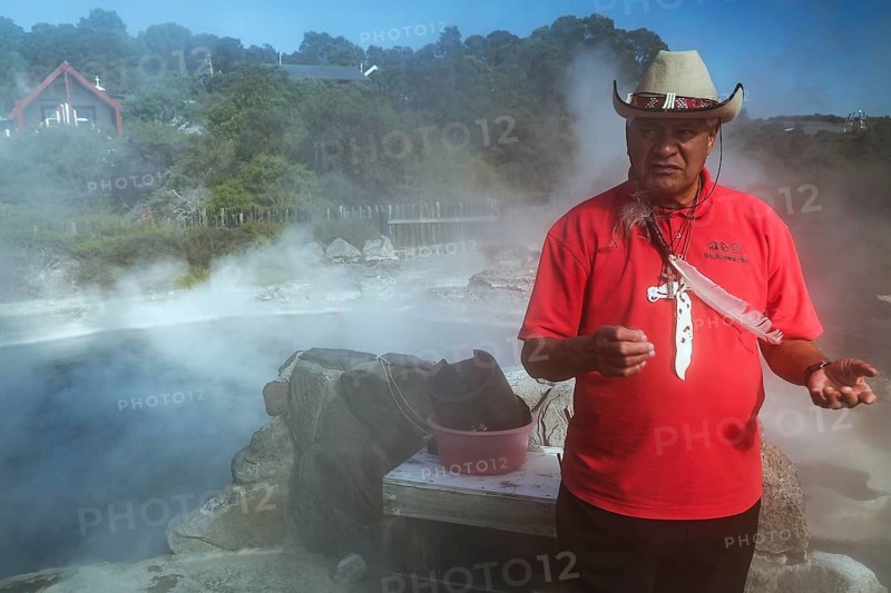 Maori guide shows how to prepare a hangi dish in Whakarewarewa, Rotorua, Bay of Plenty, New Zealand