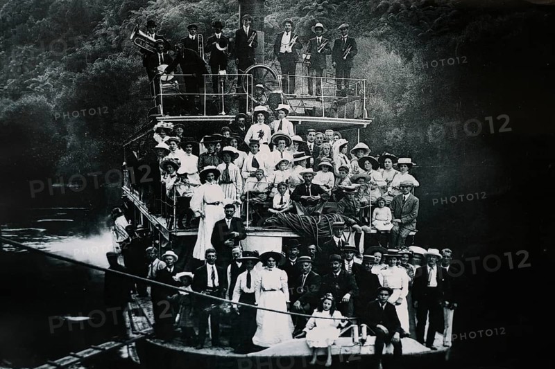 Historical photo of people on a boat on the Whanganui River, Whanganui River, Manawatu-Wanganui, New Zealand