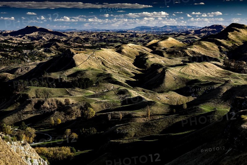 Panorama of Te Mata Peak with extensive mountain landscape under slightly cloudy sky