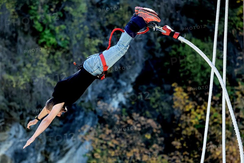 Person upside down in free fall from bungee jumping at Kawarau Bridge, Queenstown, Kawarau Bridge, New Zealand