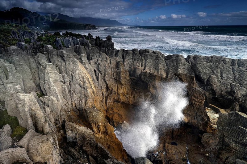 Impressive blowhole at Pancake Rocks in Punakaiki, Punakaiki, West Coast, New Zealand
