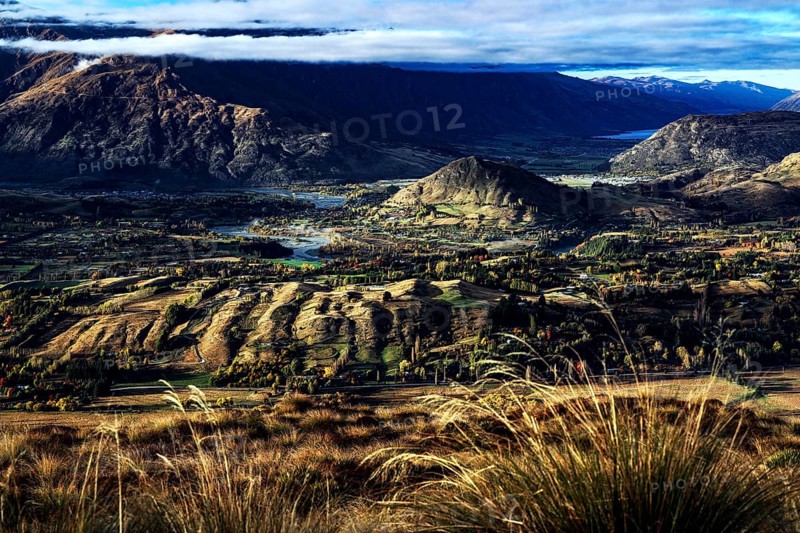 Extensive view of valleys and mountains from Coronet Peak, Queenstown, New Zealand