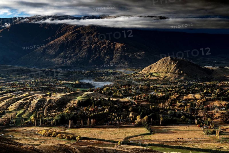 Breathtaking views from Coronet Peak with majestic mountains and dramatic clouds, Queenstown, Otago, New Zealand