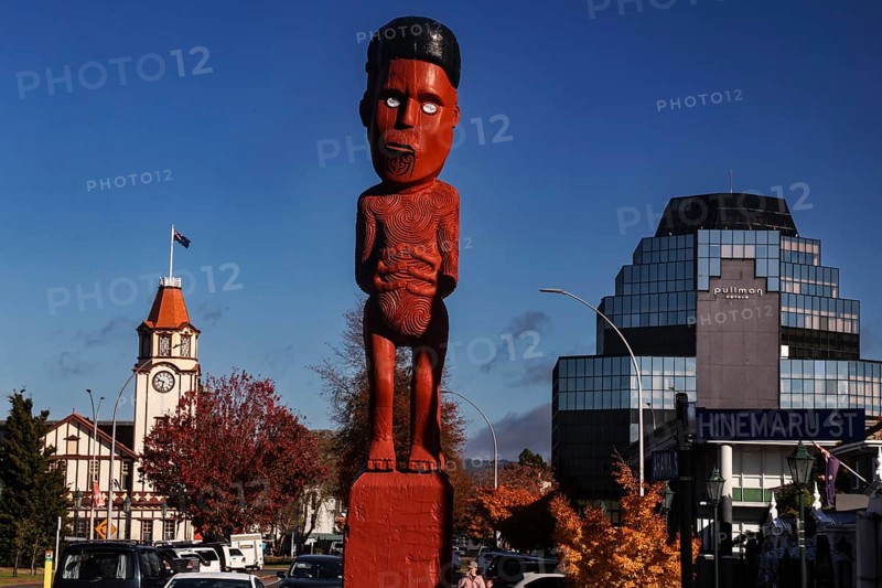 Maori figure and clock tower in Arawa Street, Rotorua, Rotorua, Bay of Plenty, New Zealand