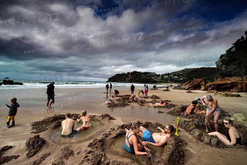 People enjoy Hot Water Beach, build sand castles and relax, Hot Water Beach, Coromandel Peninsula, New Zealand