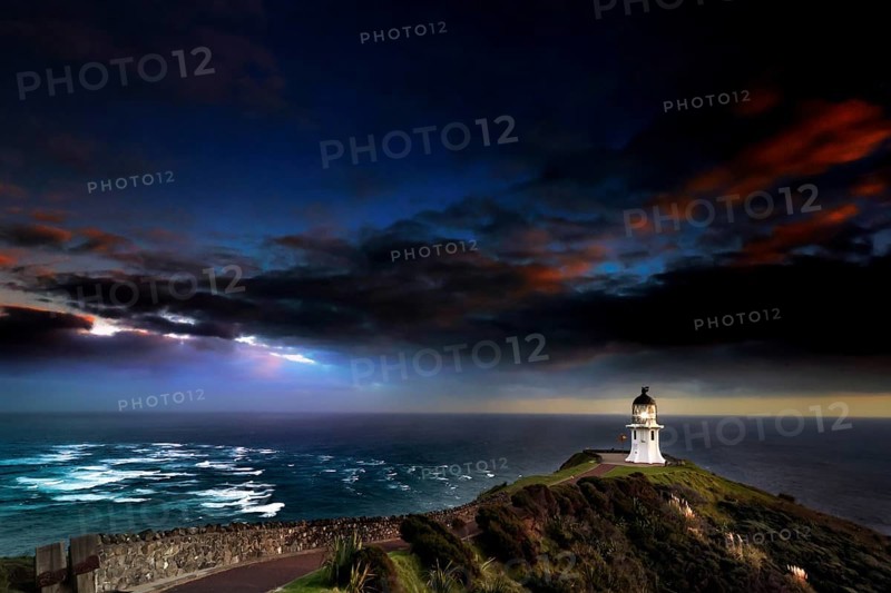 Confluence of Tasman Sea and Pacific at Cape Reinga with lighthouse and color sky, Cape Reinga, Northland, New Zealand
