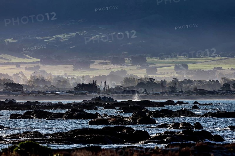 Rocky coastline of Kaikoura with views of water and countryside, Kaikoura, New Zealand