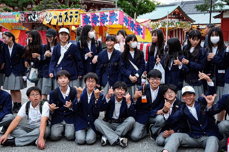 Group of students in uniform pose happily during a trip to Asakusa, Tokyo, Asakusa, Japan