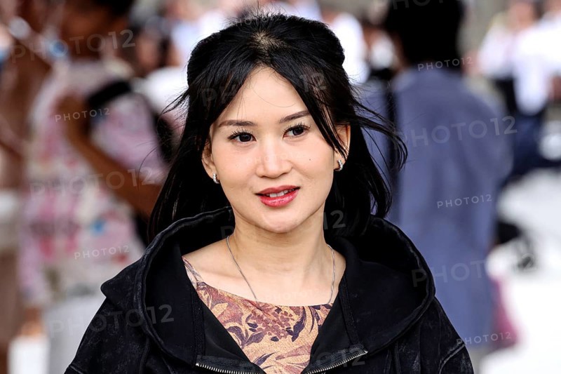 Smiling woman with black hair in busy street of Asakusa, Tokyo, Tokyo, Asakusa, Japan