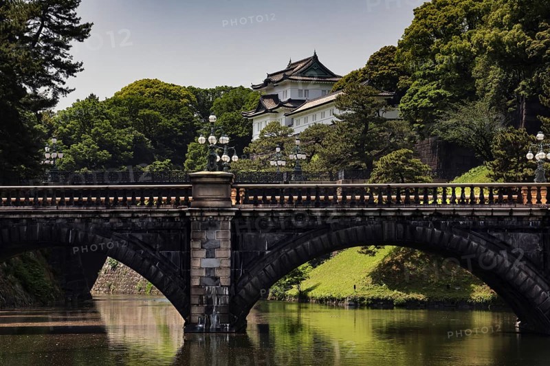 The Nijubashi Bridge in front of the Imperial Palace surrounded by lush greenery, Tokyo, Japan