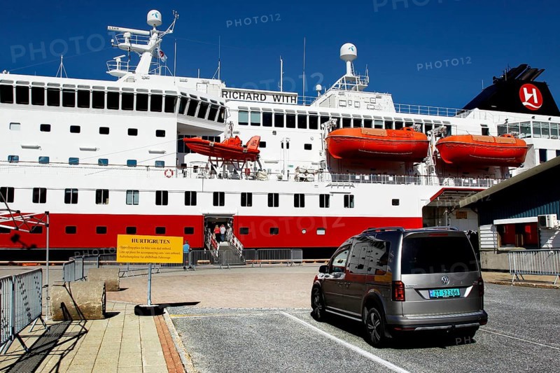 Car parked in front of a Hurtigruten ship in the port of Kirkenes, Kirkenes, Finnmark, Norway