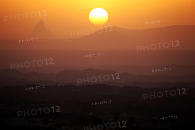 Sunset over a hilly landscape with intense warm colors, Hawzien, Gheralta, Ethiopia
