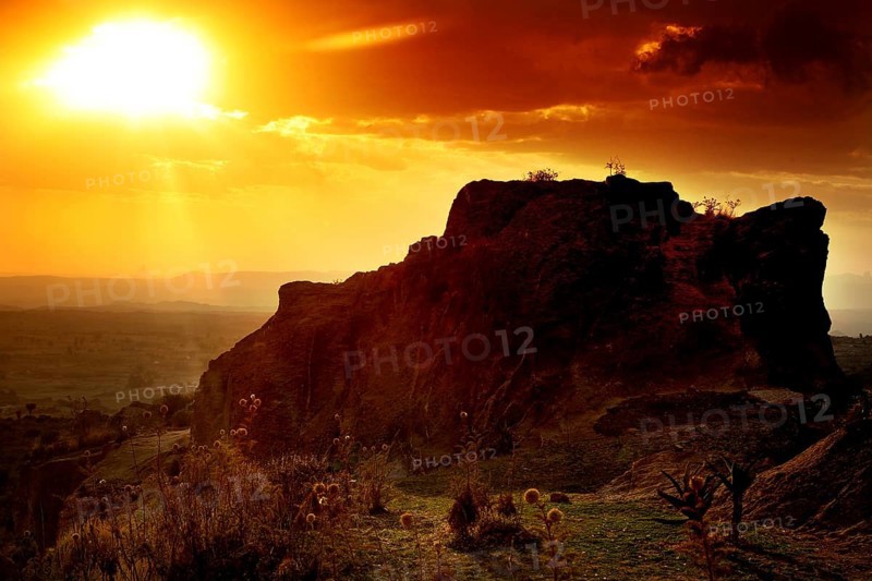 Rock formation at sunset creates a breathtaking landscape with golden sky tones, Hawzien, Tigray, Ethiopia
