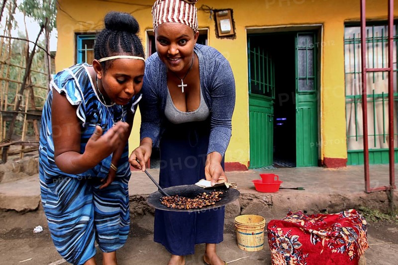 Worknesh and Dasah roast coffee and enjoy the preparation, Lalibela, Ethiopia