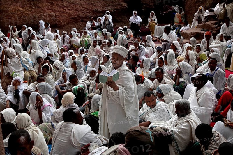 Believers in white robes gather for an Easter service in Bete Maryam, Lalibela, Ethiopia