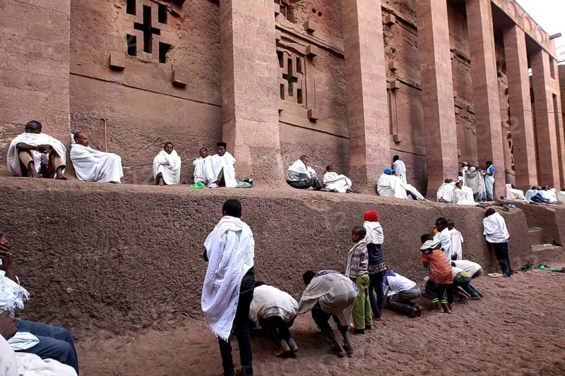 Believers in white robes pray at Bete Medhane Alem church during Easter, Lalibela, Amhara, Ethiopia