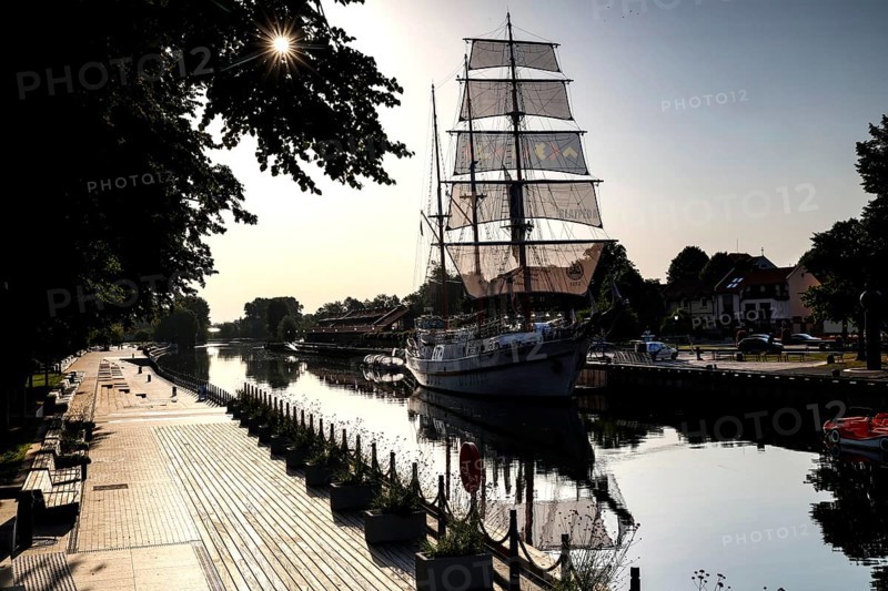 Sailing ship 'Meridianas' on the river Dange in morning light from the stock exchange bridge, Klaipeda, Klaipeda County, Lithuania