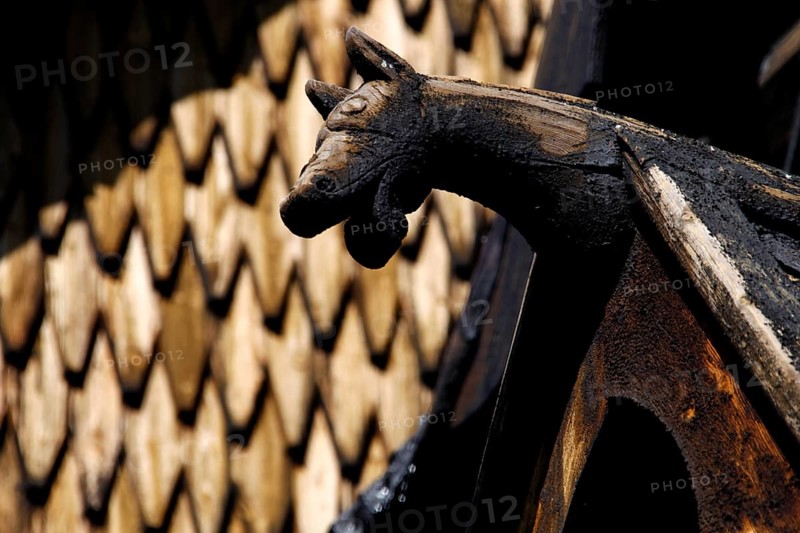 Roof figure of a stave church in Heddal with detailed wood carving, Heddal, Notodden, Norway