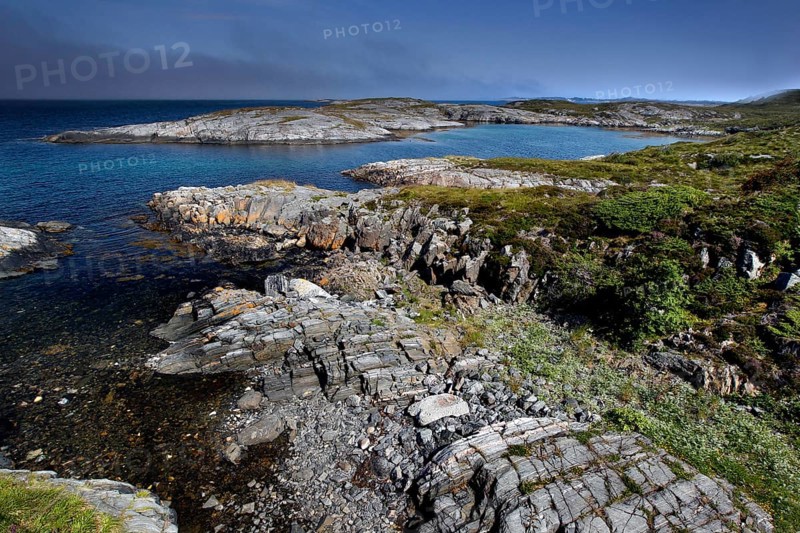 Rugged rocky coast with views from Eldhusøya across the sea near Lyngholmen, Atlanterhavsveien, Norway
