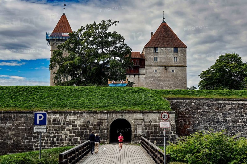 Impressive medieval castle complex with towers and entrance through a stone wall, Kuressaare, Saaremaa, Estonia