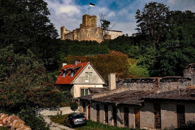 View of Rakvere Old Town with the Teutonic Order Castle in the background, surrounded by green foliage, Rakvere, Estonia