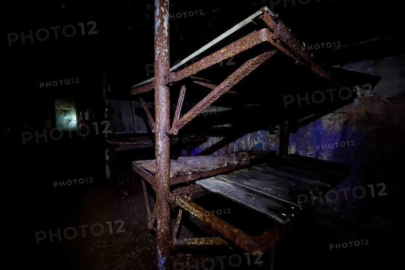 Dark abandoned bunker with rusty metal frames, Tahkuna, Hiiumaa, Estonia