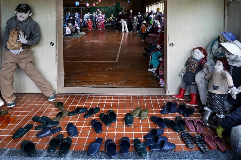 Entrance to a hall with rag dolls and lined shoes, Nagoroshimo, Japan