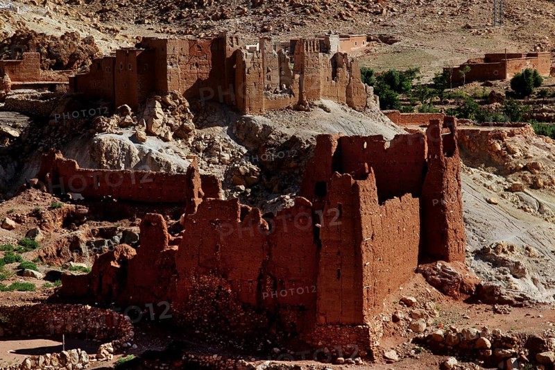 Red sandstone ruins in a desert-like landscape in the Ounilla Valley
