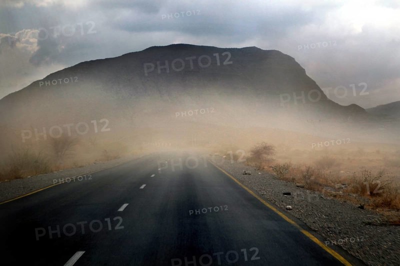 Road in a sandstorm in front of a mountain in Shehet, Shehet, Ethiopia