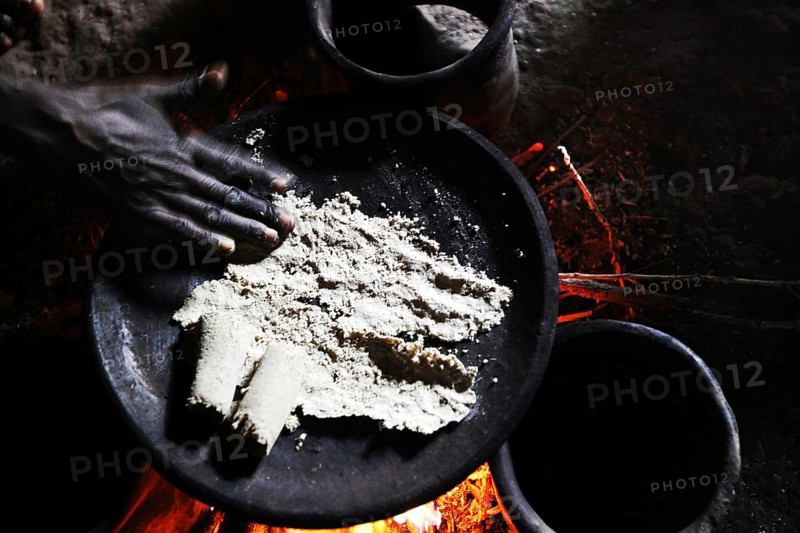 Traditional cooking on a fireplace in a hut, Yirga Alem, Ethiopia