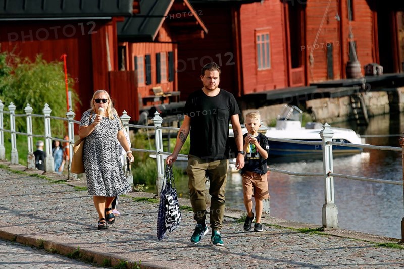 People walking in Porvoo's old town and eating ice cream, Porvoo, Finland