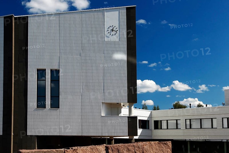 Modern town hall building with typical Alvar Aalto architecture under blue sky, Rovaniemi, Finland