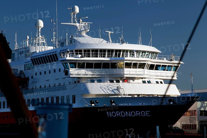 Hurtigruten ship in Svolvær harbour on Austvågøy under blue sky, Svolvær, Austvågøy, Norway