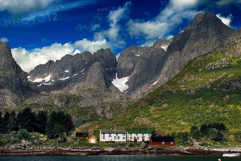 Impressive mountain landscape of Lofoten at Raftsund with distinctive mountain peaks and slightly cloudy sky, Lofoten, Nordland, Norway