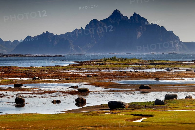 Wide coastal landscape with mountain views near Vestvågøy